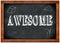 Wood frame blackboard with AWESOME text written with chalk.