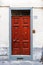 Wood front door with a magazine in a letterbox