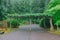 Wood gateway among trees at Portland Japanese Garden, Portland, USA