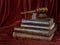 Wood gavel and stack of old books