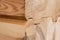 Wood Glued timber close up. Wooden grain timber end background. Glued pine timber beams. Wood for building a house. Building