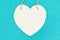 Wood heart on bright teal glitter background