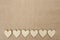 Wood hearts on hessian texture background, valentine background