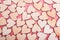 Wood hearts texture on pink background