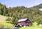 Wood house in the Alps mountains