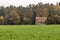 Wood house and field with forest in background around Calw village