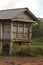 Wood hut for storage of rice straw in countryside of Laos