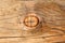 A wood knot in a wooden beam.