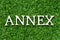 Wood letter in word annex on green grass background