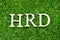 Wood letter in word HRD (Abbreviation of human resource development) on green grass background