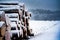 Wood logs covered in snow
