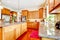 Wood luxury large kitchen with red and granite.