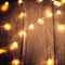 Wood panels on a deck or patio with fairy lights, blur