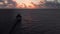 A wood pier or walkway with a palapa at the end at a holiday resort near Cancun, Mexico at sunrise.