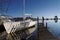 Wood piers and sailing boat in Biscarosse lake