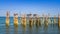 Wood pilings with blue sky ocean views