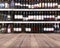 Wood plank and wine Liquor bottle on shelf - Blurred background