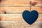 Wood planks with a chalkboard in the shape of a heart, love greeting card background with copy space
