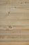 Wood planks. Kiln dried wooden lumber texture background. Unpainted unfinished pine furniture surface.