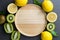 Wood plate with kiwi and lemon. Top view, flat lay