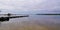 Wood pontoon on lake of Cazaux Sanguinet on french Atlantic coast panorama in landes