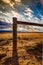 Wood Post Barbed Wire Fence on Prairie