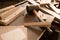 Wood products and tools lie on a workbench in a workshop