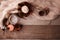 Wood scents for winter time aromatherapy. Pine cones, candles, essential oil bottles, top view. Spa relax winter concept, copy