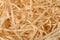 Wood shavings background close-up, soft diffused light. Concept of environmentally friendly packaging of fragile items