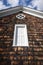 Wood Shingled Barn Gable with White Door