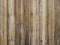 Wood slats background,old exterior cladding with vertical planks.