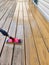 Wood stain with a paint pad on wooden deck floor