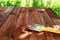 Wood staining. Brush. Painting wooden patio deck with protective varnish