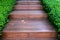 Wood stair way on green garden