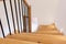 Wood staircase inside contemporary white modern house.