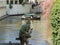 Wood statue of a gnome on a Kampa canal in Prague in Czech Republic.