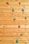 Wood surface of an artificial rock climbing wall with hand a