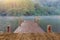 Wood table with blur wood bridge dock lake travel background