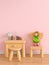 Wood table and chair in pink child room, 3D rendering