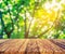 wood table and green tree bokeh