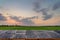 wood table for product montage and display with rice field sunset.