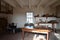 Wood table with shelves and pots and containers and window