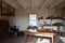 Wood table with shelves and pots and containers and window