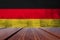 Wood Table Top Background with Germany national flag.