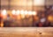 Wood table top Bar with blur colorful light bokeh in cafe,restaurant background