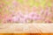 Wood table top on blur flower garden background