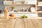 Wood table top with blur kitchen counter decoration for montage product display. background for cooking food layout concept