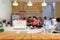 Wood table top with blur of people in coffee shop background. For montage product display or design key visual layout