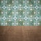 Wood table top and blur vintage ceramic tile pattern wall