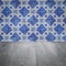 Wood table top and blur vintage ceramic tile pattern wall